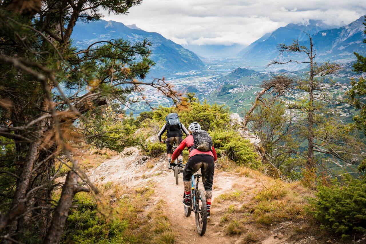 2 mountainbiker riding from crans montana towards sion